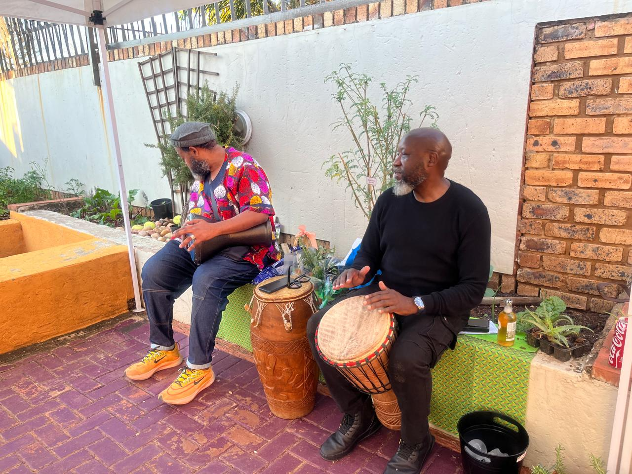 Team in action — drummer at garden tour